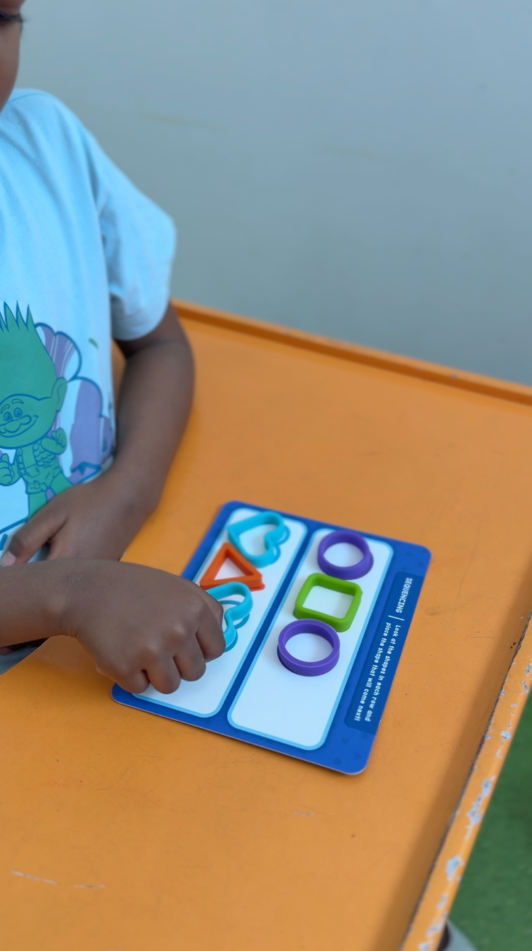 Occupational Therapist helps children develop skills needed for daily life such as writing, dressing, feeding, focusing, and sensory regulation.